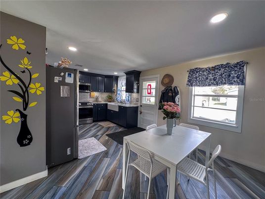 Dining room, Interior, Kitchen, Recessed Lighting, Stainless Steel Appliances, Wood Texture Flooring