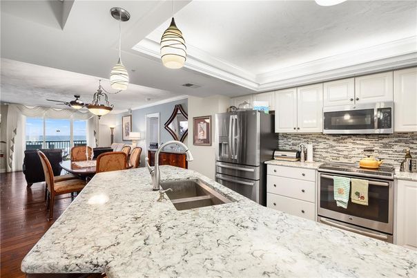Dining room, Interior, Kitchen, Pendant Lights, Stainless Steel Appliances, Wood Texture Flooring