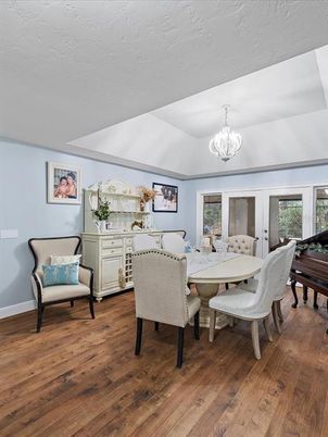 Chandelier, Dining room, Interior, Piano, Wood Texture Flooring