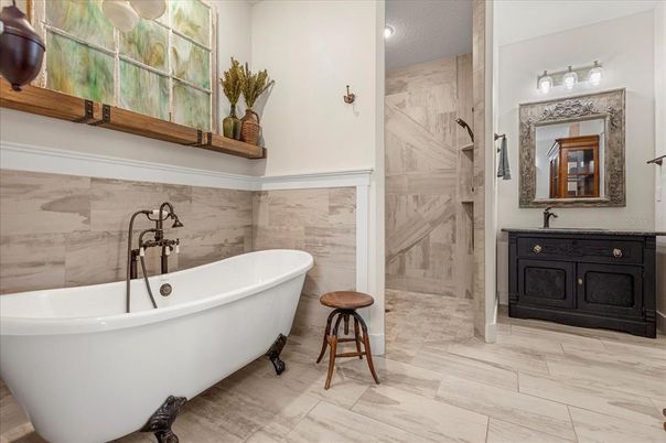 Bathroom, Free Standing Baths, Glass Shower, Interior, Marble, Marble Walls, Recessed Lighting, Wood Texture Flooring