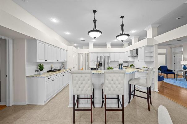 Dining room, Interior, Kitchen, Pendant Lights, Recessed Lighting, Stainless Steel Appliances, Wood Texture Flooring