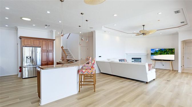 Fireplace, Interior, Kitchen, Living room, Pendant Lights, Recessed Lighting, Stainless Steel Appliances, Wood Texture Flooring