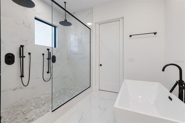 Bathroom, Free Standing Baths, Glass Shower, Interior, Marble, Marble Walls, Recessed Lighting