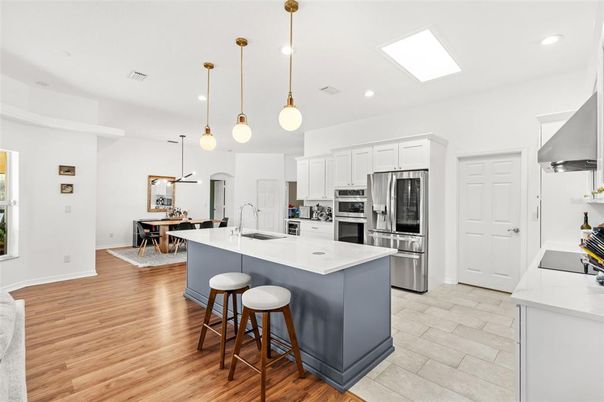 Dining room, Interior, Kitchen, Pendant Lights, Recessed Lighting, Stainless Steel Appliances, Wood Texture Flooring