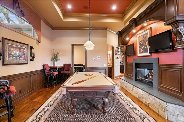Billiard Table, Dining room, Fireplace, Game Room, Interior, Pendant Lights, Recessed Lighting, Wood Texture Flooring
