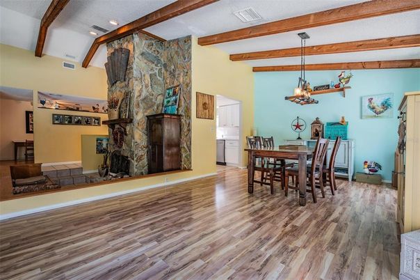 Chandelier, Dining room, Fireplace, Interior, Recessed Lighting, Wooden Beams, Wood Texture Flooring