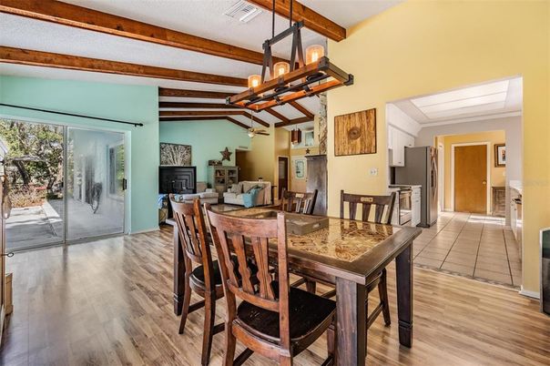 Chandelier, Dining room, Fireplace, Interior, Kitchen, Pendant Lights, Wooden Beams, Wood Texture Flooring