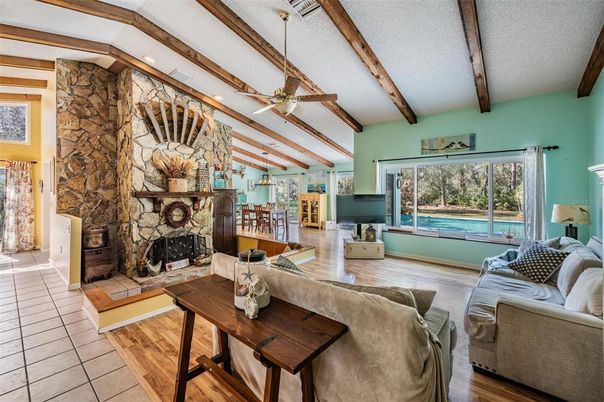 Dining room, Fireplace, Interior, Living room, Stone Walls, Wooden Beams, Wood Texture Flooring