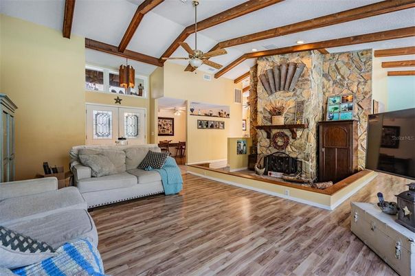 Fireplace, Interior, Living room, Recessed Lighting, Stone Walls, Wooden Beams, Wood Texture Flooring