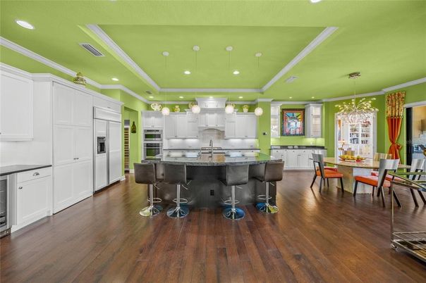 Dining room, Interior, Kitchen, Pendant Lights, Recessed Lighting, Stainless Steel Appliances, Wood Texture Flooring
