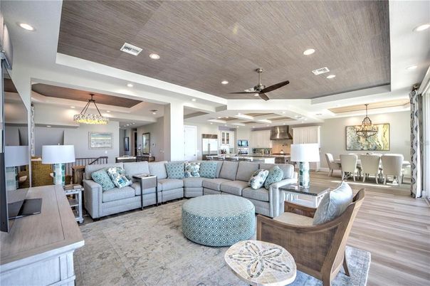 Chandelier, Dining room, Interior, Kitchen, Living room, Pendant Lights, Recessed Lighting, Stainless Steel Appliances, Wood Texture Flooring