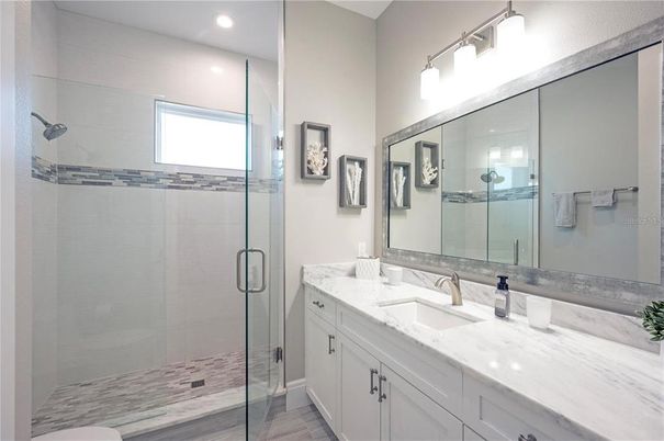 Bathroom, Dual Sink Vanities, Glass Shower, Interior, Recessed Lighting, Wood Texture Flooring