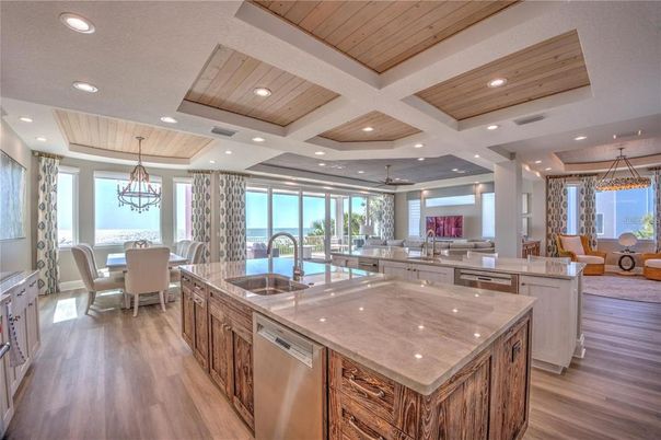 Chandelier, Dining room, Interior, Kitchen, Living room, Pendant Lights, Recessed Lighting, Stainless Steel Appliances, Wooden Ceilings, Wood Texture Flooring