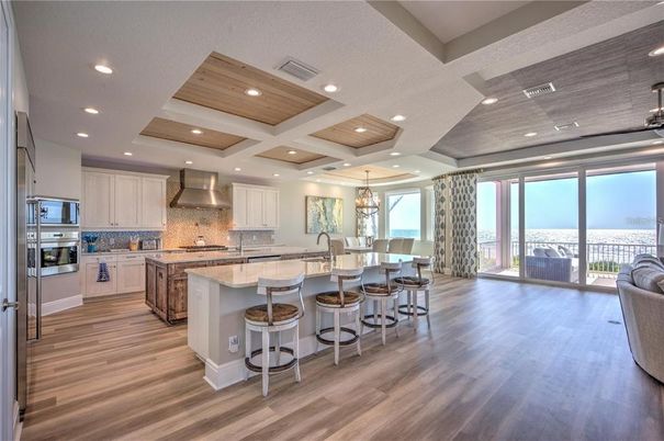 Chandelier, Dining room, Interior, Kitchen, Pendant Lights, Recessed Lighting, Stainless Steel Appliances, Wooden Ceilings, Wood Texture Flooring