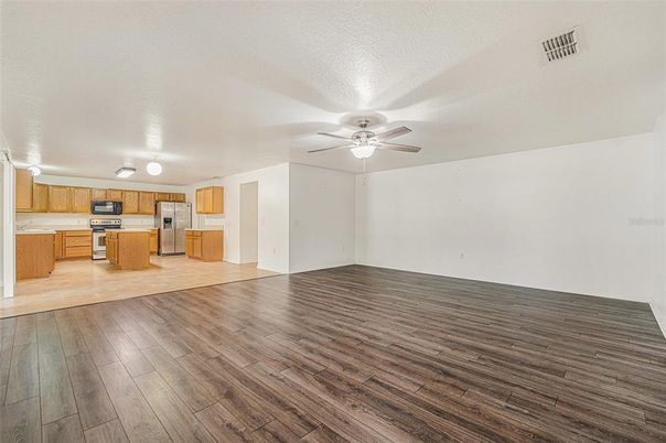 Empty room, Interior, Kitchen, Stainless Steel Appliances, Wood Texture Flooring