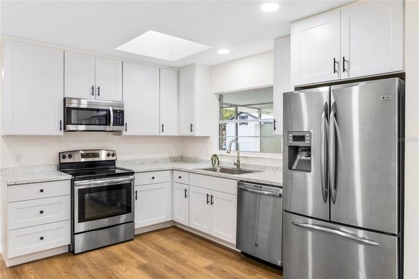 Interior, Kitchen, Recessed Lighting, Stainless Steel Appliances, Wood Texture Flooring