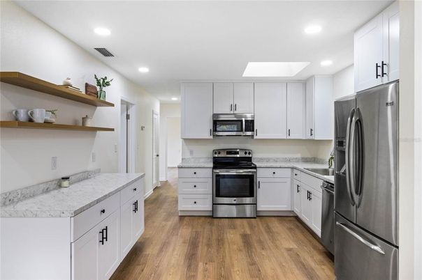 Interior, Kitchen, Recessed Lighting, Stainless Steel Appliances, Wood Texture Flooring