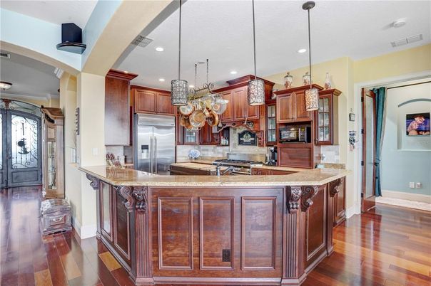Chandelier, Interior, Kitchen, Pendant Lights, Recessed Lighting, Stainless Steel Appliances, Wood Texture Flooring