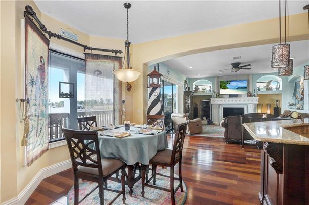 Dining room, Fireplace, Interior, Living room, Pendant Lights, Recessed Lighting, Wood Texture Flooring