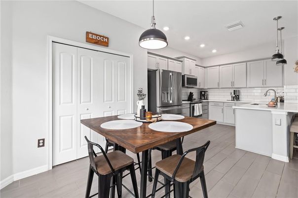 Dining room, Interior, Kitchen, Pendant Lights, Recessed Lighting, Stainless Steel Appliances, Wood Texture Flooring