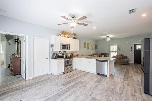Interior, Kitchen, Recessed Lighting, Stainless Steel Appliances, Wood Texture Flooring