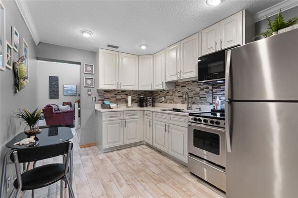 Interior, Kitchen, Recessed Lighting, Stainless Steel Appliances, Wood Texture Flooring