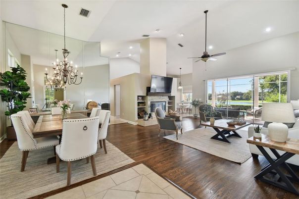 Chandelier, Dining room, Fireplace, Interior, Living room, Pendant Lights, Recessed Lighting, Wood Texture Flooring