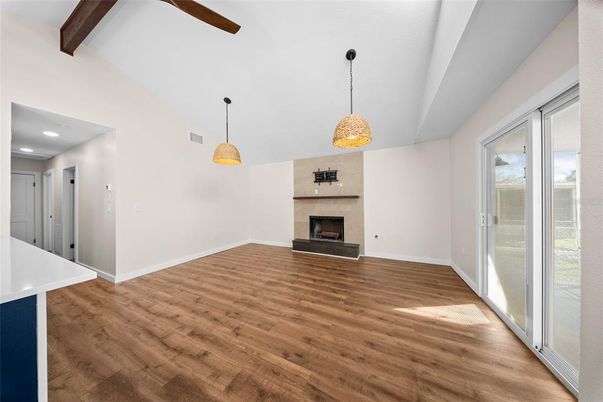 Empty room, Fireplace, Interior, Pendant Lights, Recessed Lighting, Wooden Beams, Wood Texture Flooring
