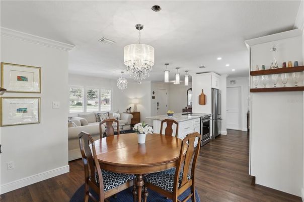 Chandelier, Dining room, Interior, Kitchen, Living room, Pendant Lights, Recessed Lighting, Stainless Steel Appliances, Wood Texture Flooring