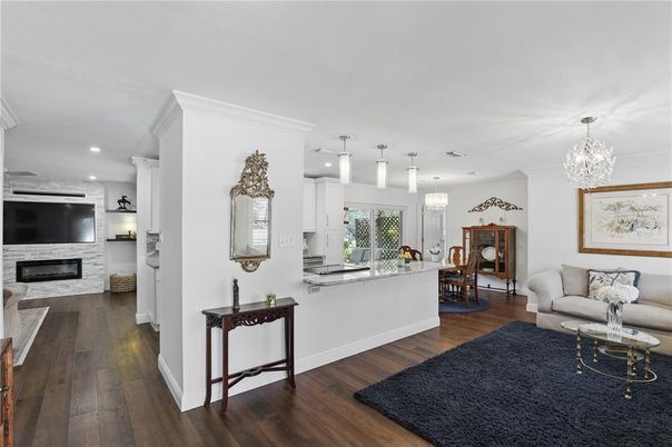 Chandelier, Dining room, Fireplace, Interior, Kitchen, Living room, Pendant Lights, Recessed Lighting, Wood Texture Flooring