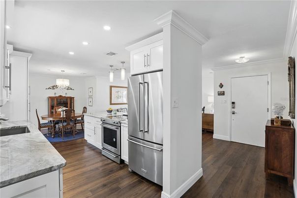 Chandelier, Dining room, Interior, Kitchen, Recessed Lighting, Stainless Steel Appliances, Wood Texture Flooring