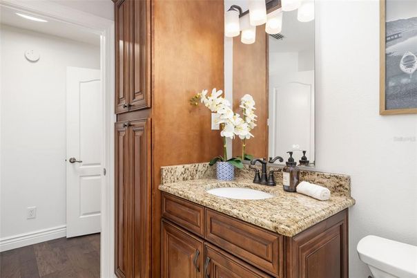 Bathroom, Dual Sink Vanities, Interior, Recessed Lighting, Wood Texture Flooring