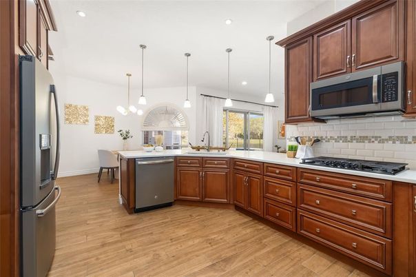 Dining room, Interior, Kitchen, Pendant Lights, Recessed Lighting, Stainless Steel Appliances, Wood Texture Flooring