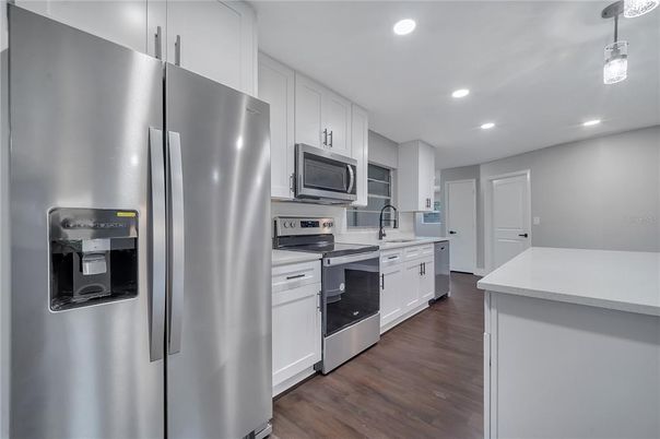 Interior, Kitchen, Pendant Lights, Recessed Lighting, Stainless Steel Appliances, Wood Texture Flooring
