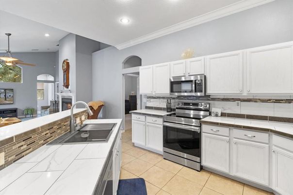 Fireplace, Interior, Kitchen, Recessed Lighting, Stainless Steel Appliances