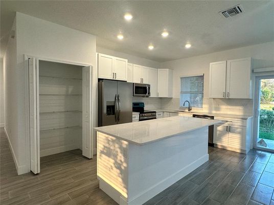 Interior, Kitchen, Recessed Lighting, Stainless Steel Appliances, Wood Texture Flooring