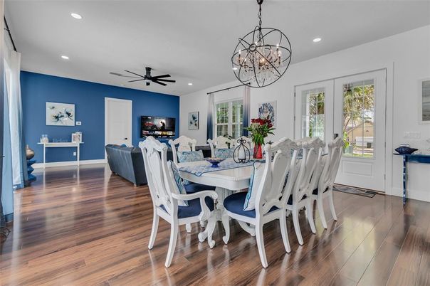 Chandelier, Dining room, Fireplace, Interior, Living room, Recessed Lighting, Wood Texture Flooring