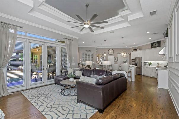 Chandelier, Dining room, Interior, Kitchen, Living room, Pendant Lights, Recessed Lighting, Stainless Steel Appliances, Wood Texture Flooring