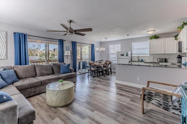 Chandelier, Dining room, Interior, Kitchen, Living room, Stainless Steel Appliances, Wood Texture Flooring