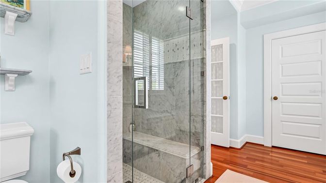 Bathroom, Glass Shower, Interior, Marble Walls, Wood Texture Flooring