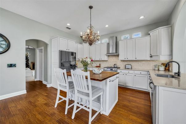 Chandelier, Interior, Kitchen, Recessed Lighting, Stainless Steel Appliances, Wood Texture Flooring