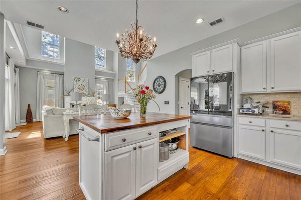 Chandelier, Interior, Kitchen, Living room, Recessed Lighting, Stainless Steel Appliances, Wood Texture Flooring