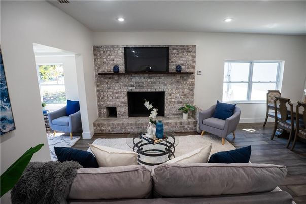 Fireplace, Interior, Living room, Recessed Lighting, Stone Walls, Wood Texture Flooring