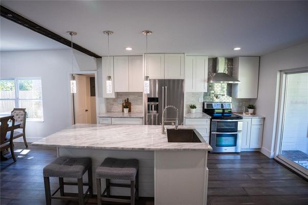 Interior, Kitchen, Pendant Lights, Recessed Lighting, Stainless Steel Appliances, Wood Texture Flooring
