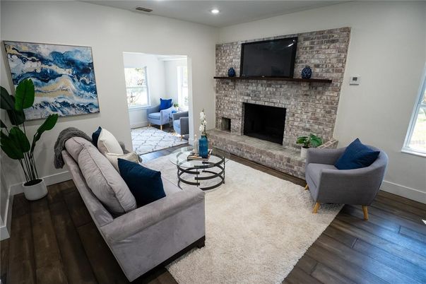 Fireplace, Interior, Living room, Recessed Lighting, Stone Walls, Wood Texture Flooring
