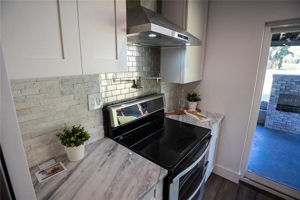 Interior, Kitchen, Stainless Steel Appliances, Stone Walls, Wood Texture Flooring
