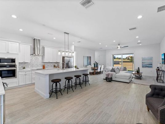 Dining room, Interior, Kitchen, Living room, Pendant Lights, Recessed Lighting, Stainless Steel Appliances, Wood Texture Flooring
