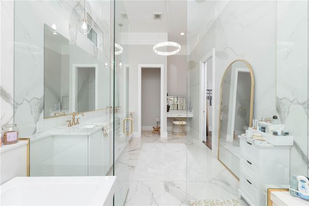 Bathroom, Dual Sink Vanities, Glass Shower, Interior, Marble, Marble Walls, Pendant Lights, Recessed Lighting