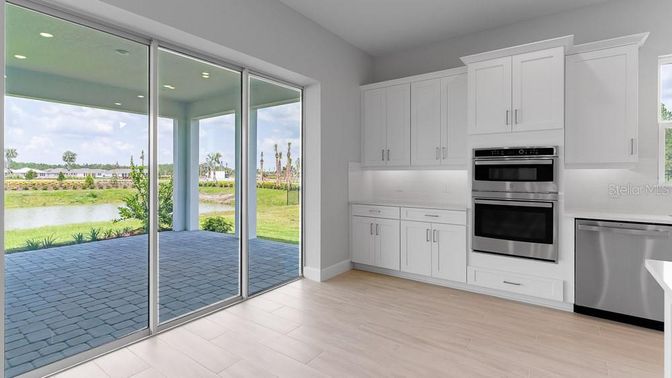 Interior, Kitchen, Recessed Lighting, Stainless Steel Appliances, Water, Wood Texture Flooring