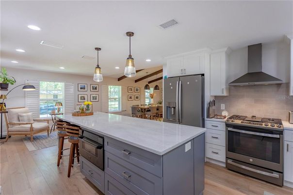 Dining room, Interior, Kitchen, Pendant Lights, Recessed Lighting, Stainless Steel Appliances, Wood Texture Flooring